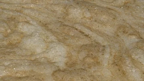 Abstract patterns, shapes and textures of white and brown river waste foam 2 Stock Footage 287996608