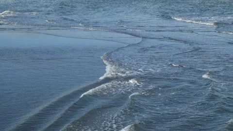 Abstract patterns, shapes and textures of sea wave movements on beach sand Video stock 291468723