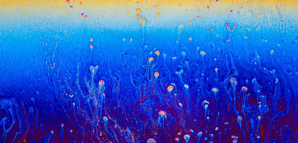 Abstract patterns space fantasy reflection cosmic on a soap bubble. Stock Photos