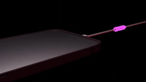 Abstract phone charging with charging cable on a black background. Pink energy Stock Footage 252673861