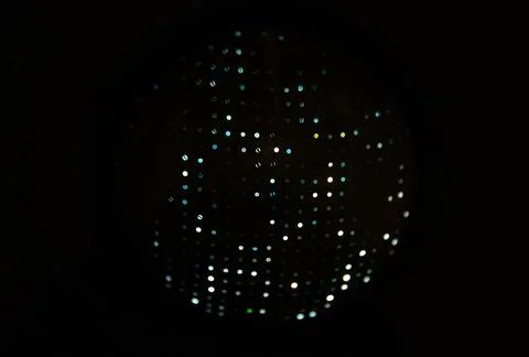Abstract photo of a circular panel covered in uniform tiny dots Stock Photos