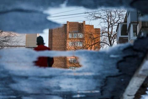 Abstract photography. Reflection in a spring puddle. Residential high-rise bu Stock Photos