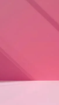 Abstract pink background of empty studio with shadow from the window Stock Photos