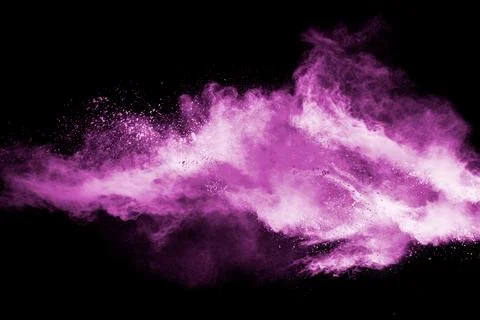 Abstract pink dust particles explosion on black background.Freeze motion of.. Stock Photos
