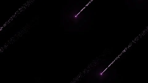 Abstract pink light particle streaks moving diagonally across a deep dark b.. Vídeos de archivo 342480451