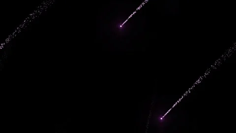 Abstract pink light particle trails moving diagonally across dark space bac.. Stock Footage 342480484
