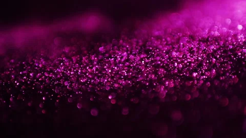 Abstract pink particles in motion over dark background Stock Footage 168762380