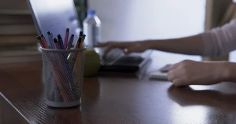 Abstract plan, office space in defocus, woman types text on keyboard, notes Stock Footage 131004405