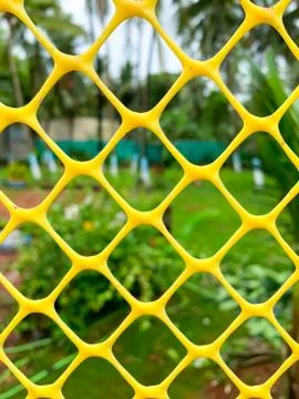 Abstract plastic net texture and green garden background Stock Photos