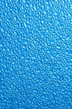 Abstract polygonal pattern on a blue plastic window on the lumen Foto stock