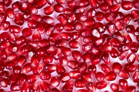 Abstract pomegranate seeds pattern creating vivid texture and contrast, repea Stock Photos