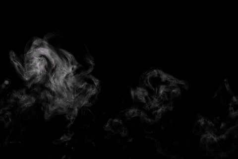Abstract powder or smoke effect isolated on black background Stock Photos