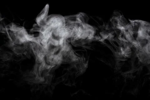Abstract powder or smoke effect isolated on black background Stock Photos
