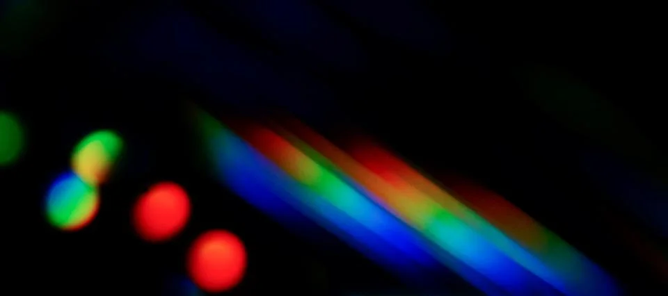 Abstract prism light reflection rainbow colors ,leak overlay effect on black bac Stock Photos
