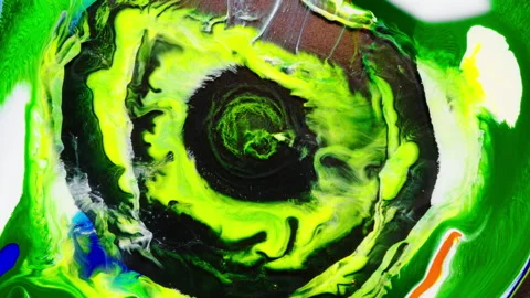 Abstract Psychedelic Ink yellow green Patterns in Motion drop of paint expansion Stock Footage 327296900