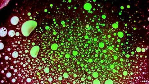 Abstract psychedelic liquid art dynamic pattern with green and blue balls Stock Footage 125956013