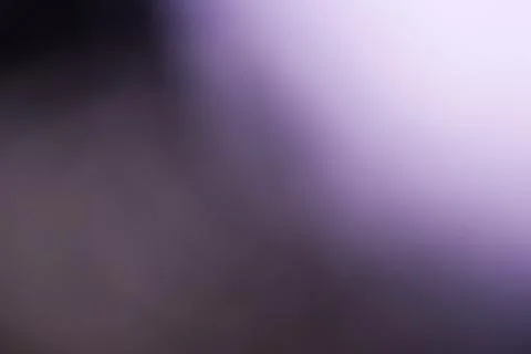 Abstract purple and black gradient background with soft light transition Stock Photos