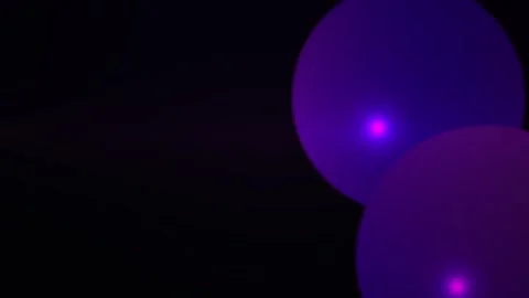 Abstract purple bokeh light circles floating smoothly on a dark background .. Stock Footage 346350551