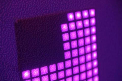 Abstract purple illuminated grid pattern with glowing square lights on text.. 写真素材