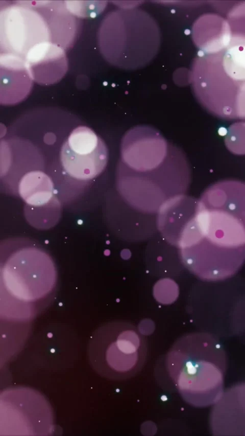 Abstract purple liquid droplets glowing under dark ambient lighting for creative Stock Footage 347692425
