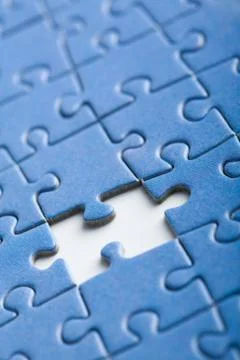 Abstract puzzle background with one piece missing Stock Photos