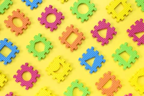 Abstract puzzle pattern. Soft children's multi-colored jigsaw puzzles Stock Photos