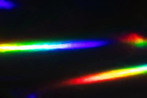 Abstract Rainbow Light Streaks on Dark Background: Colorful Spectrum Reflec.. Stock Photos