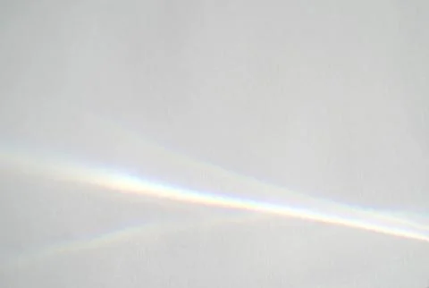 Abstract rainbow rays of light shadow overlay effect from sunlight on a white Stock Photos