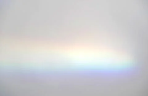 Abstract rainbow rays of light shadow overlay effect from sunlight on a white Foto stock