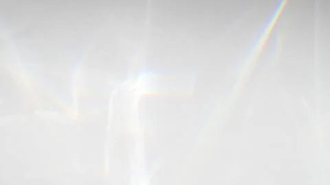 Abstract rainbow rays of light shadow overlay effect from sunlight on a whi.. Stock Photos