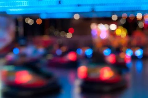 Abstract random colourful defocused blurred go-kart cars of fun fair backgr.. Stock Photos