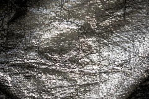 Abstract real fabric surface background. Aluminum Platinum Silver foil Tarpaulin Stock Photos