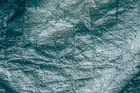 Abstract real fabric surface background. Aluminum Platinum Silver foil Tarpaulin Foto stock