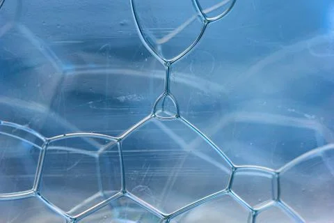 Abstract rectangular shaped soap bubbles in plastic bottle macro close up fro Stock Photos