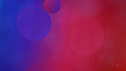 Abstract red and blue floating oil droplets swirling on water in slow motion Vídeo Stock 149063426