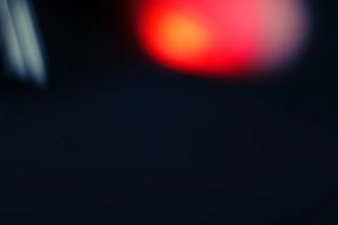 Abstract Red and Orange Light Leak Textures on Black Background Stock Photos