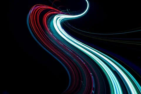 Abstract red and teal light trails with elegant curves on black Иллюстрация