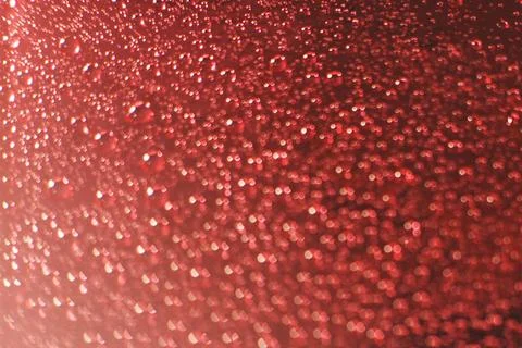 Abstract red background with bokeh and drops of water Stock Photos