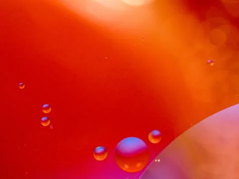 Abstract red background. Bubbles in abstract universe. Macro shot. Blurred Stock Photos