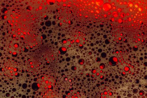 Abstract red background. Colored soap foam texture. Gel foam with bubbles Foto stock