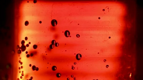Abstract red background with dark bubbles and glowing light Stock Footage 345857211