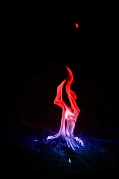 Abstract red-blue fire flames on dark background. Foto stock