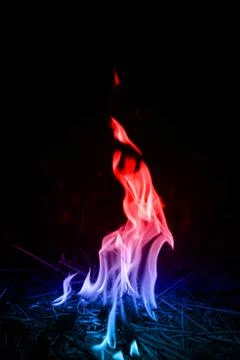 Abstract red-blue fire flames on dark background. Stock Photos