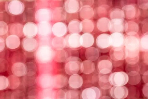 Abstract Red blurred background with white bokeh circles. Stock Photos