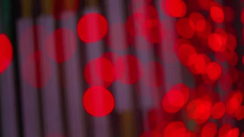 Abstract red bokeh lights pulsing in a dark city night background Video stock 342330086