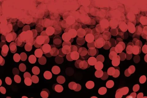 Abstract red bokeh lights, textured background with glowing circles on dark.. Stock Illustration
