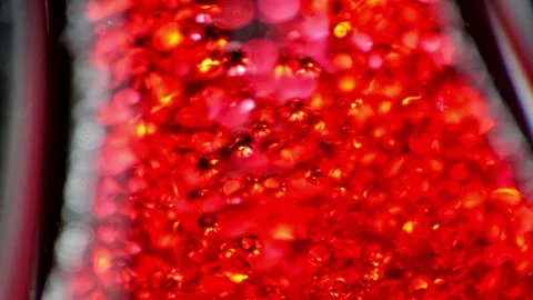 Abstract red bubbles flowing into water Stock-Footage 101745341