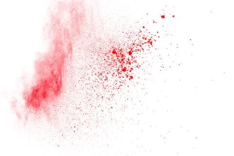 Abstract red dust explosion on white background. Freeze motion of red powder. Stock Photos