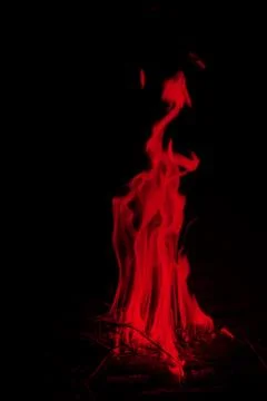 Abstract red fire flames on dark background. Stock Photos