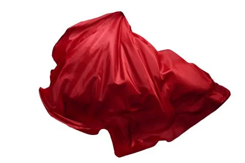 Abstract red flying fabric isolated on white background Foto stock